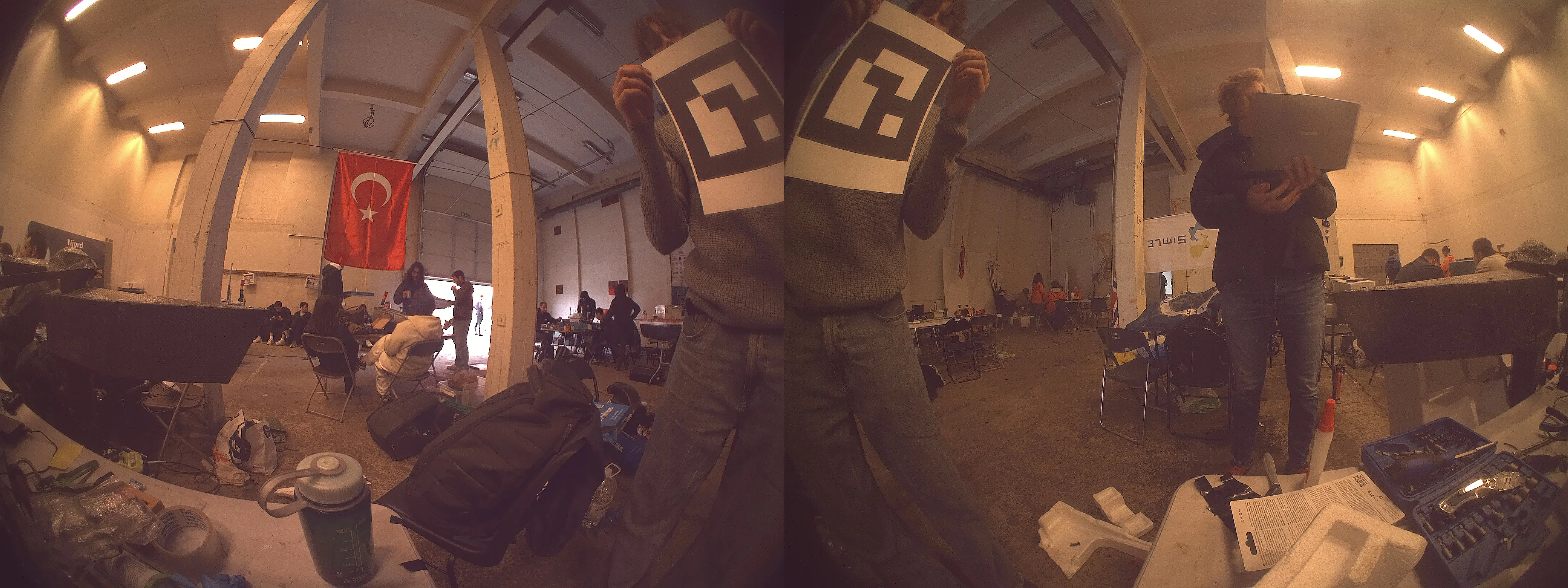 The two 220° camera frames joined into a single wide view of the scene in front of the boat
